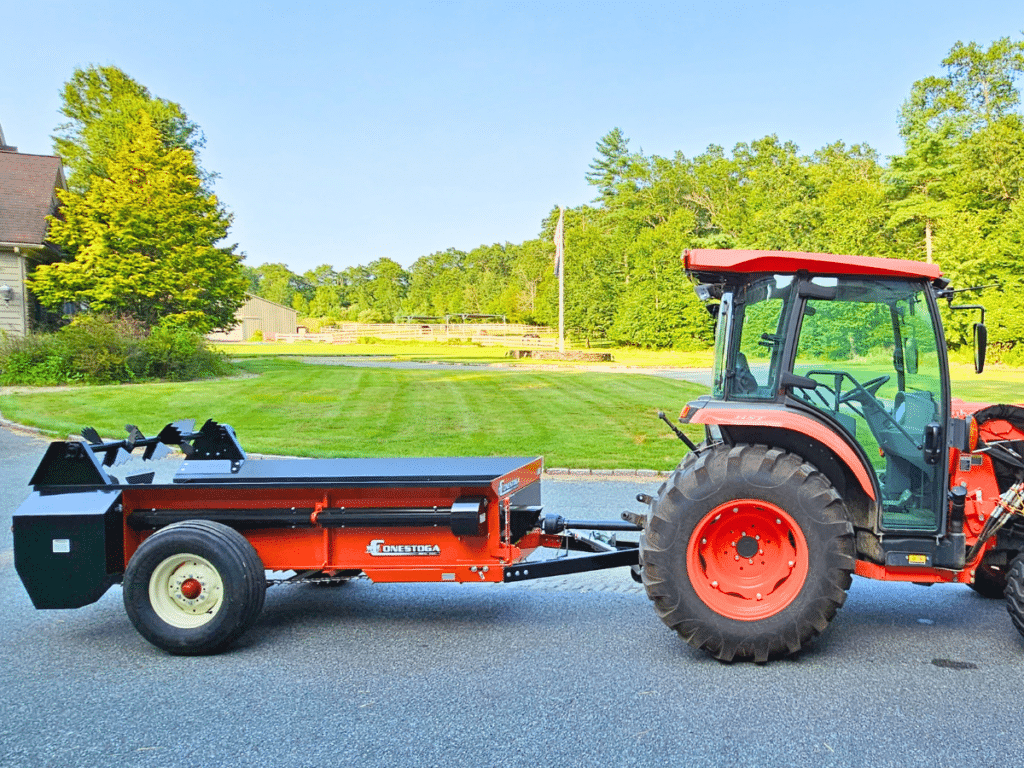 C-80  PTO driven manure spreader pulled by a small tractor